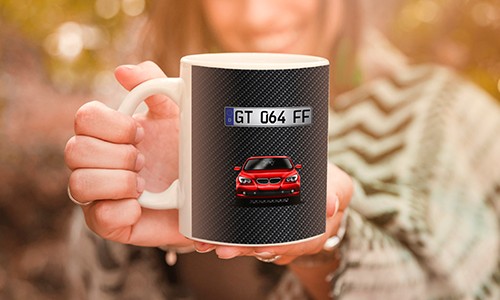 car mug with a woman in the background