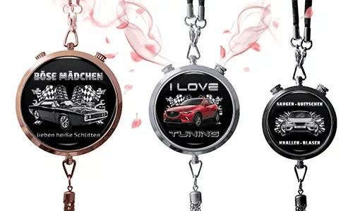 Three round pendants with car themes on black backgrounds. Left: vintage car with German text and checkered flags. Center: red SUV, 