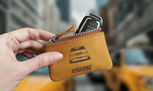Brown zippered pouch with printed truck front and plate 