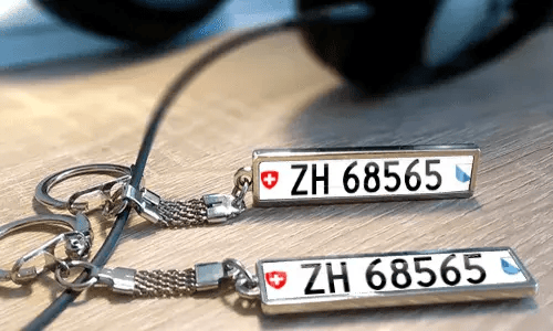 Personalized metal keychains with custom text and license plate style tags