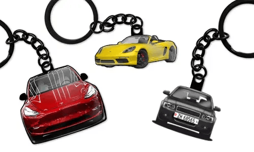Personalized keychains displaying three different car models in red, yellow, and blue