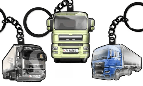 Llaveros con forma de camión con tres diseños diferentes, incluyendo modelos verde, gris y azul