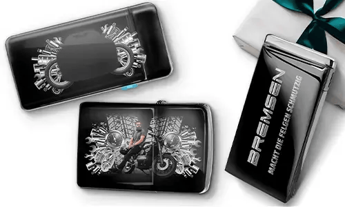 Sleek gift boxes featuring a blue car and a biker surrounded by metallic gears. One box reads 