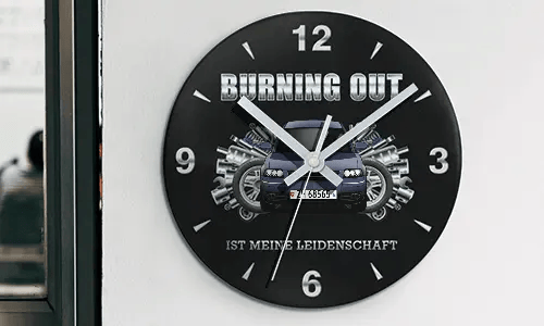 Wall clock with motorcycle and engine graphics, BURNING OUT IST MEINE LEIDENSCHAFT text on black face